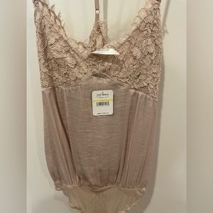 Free People champagne pink silky bodysuit. New with tags. Size Medium.